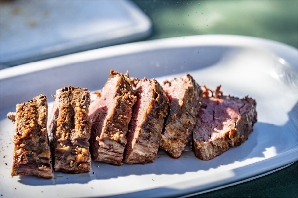 Medium-cooked beef steak served on a plate