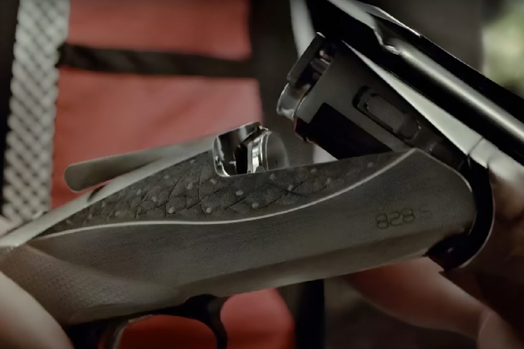 Close-up of Benelli shotgun loading port where cartridges are inserted”
