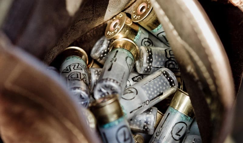 Shotgun shells in a worn leather shell pouch, ready for the field