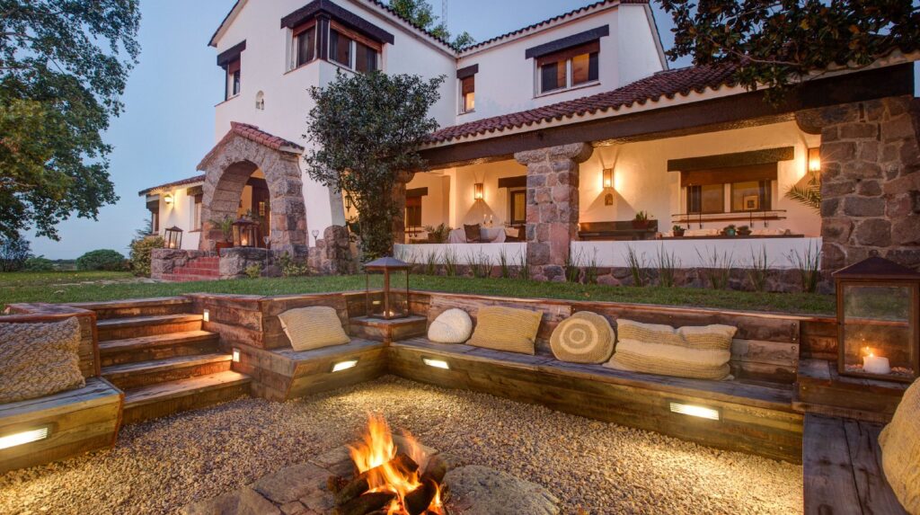 La Porteñita, an H&H lodge in Córdoba, with its fire pit lit at dusk